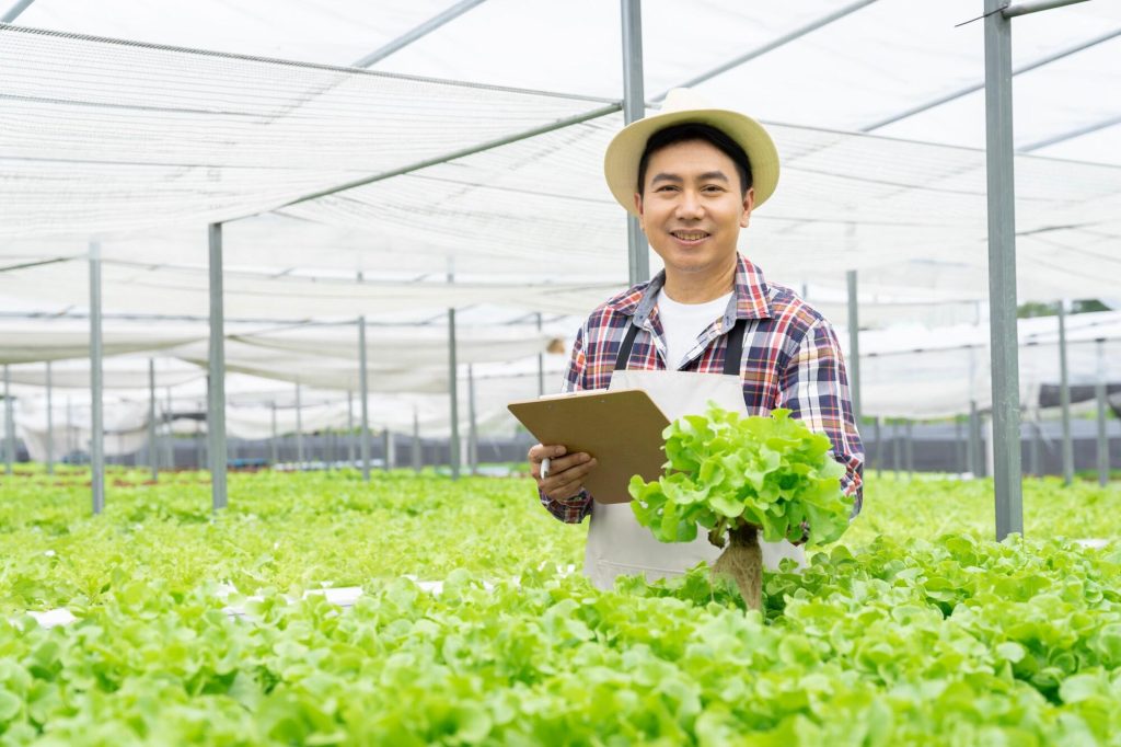 asian-man-picking-vegetables-happy-inspecting-your-2025-03-18-15-00-07-utcResized-1.jpg